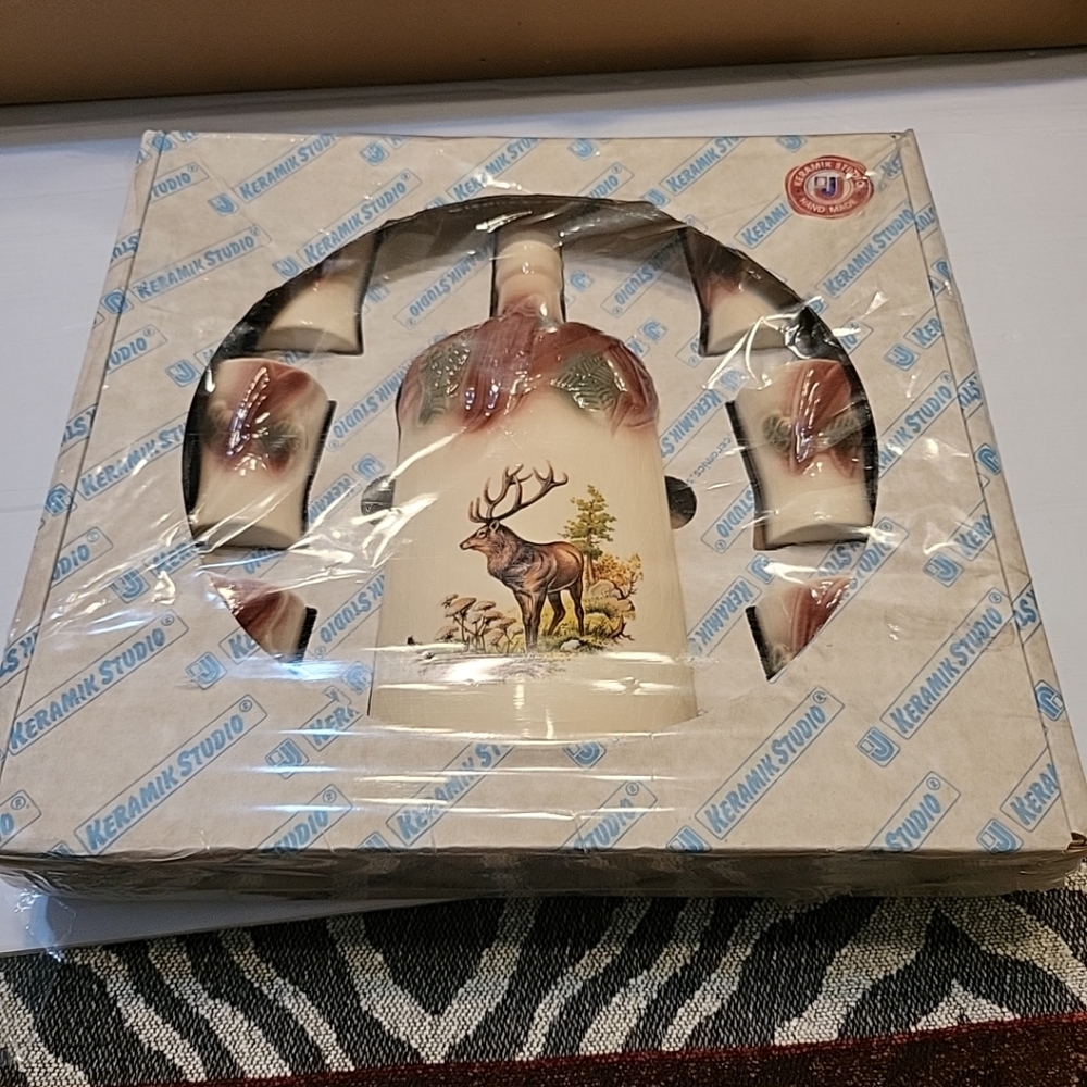 Keramik Studio It's a vintage porcelain flask set with a hunting motif